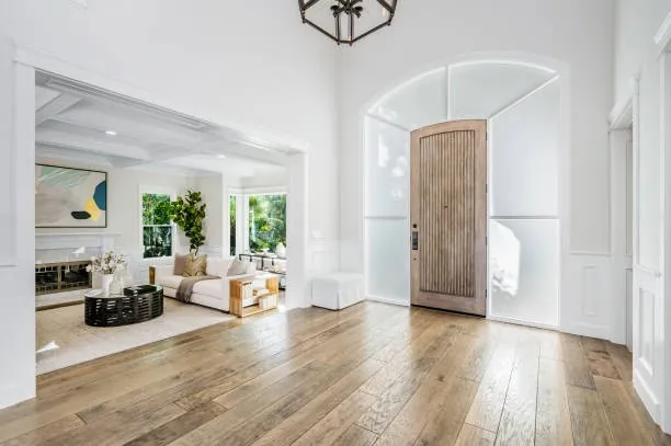 Hardwood flooring features a subtle surface sheen across a clean, even installation.