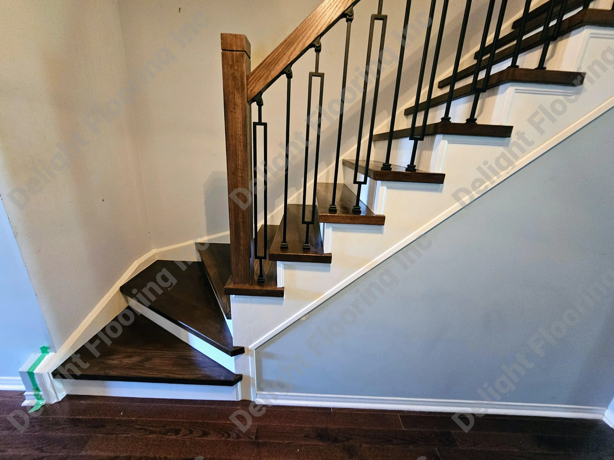 Hardwood staircase showing finished wood treads, risers, and nosing.
