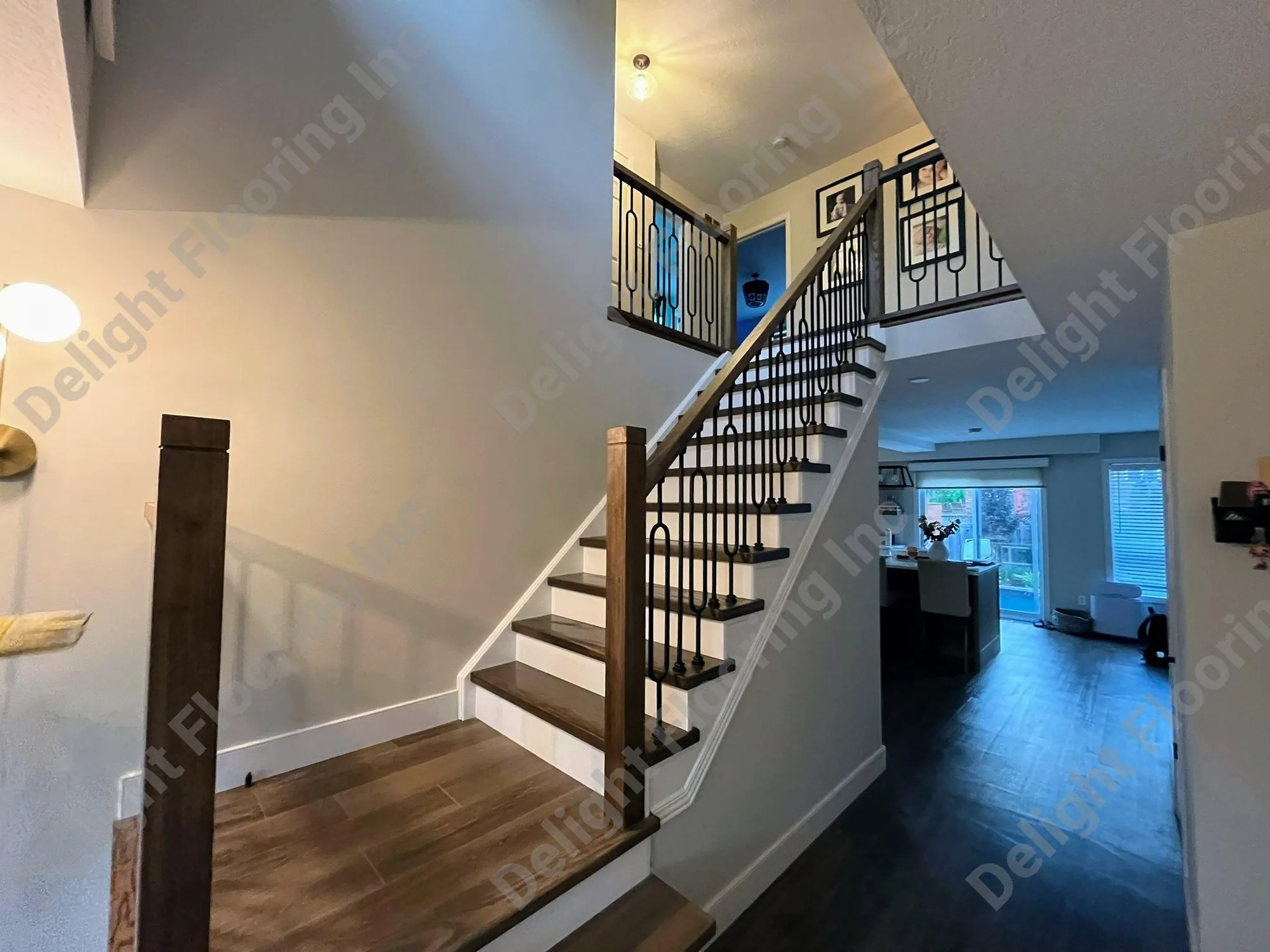 Hardwood staircase showing finished wood treads, risers, and nosing with visible grain.